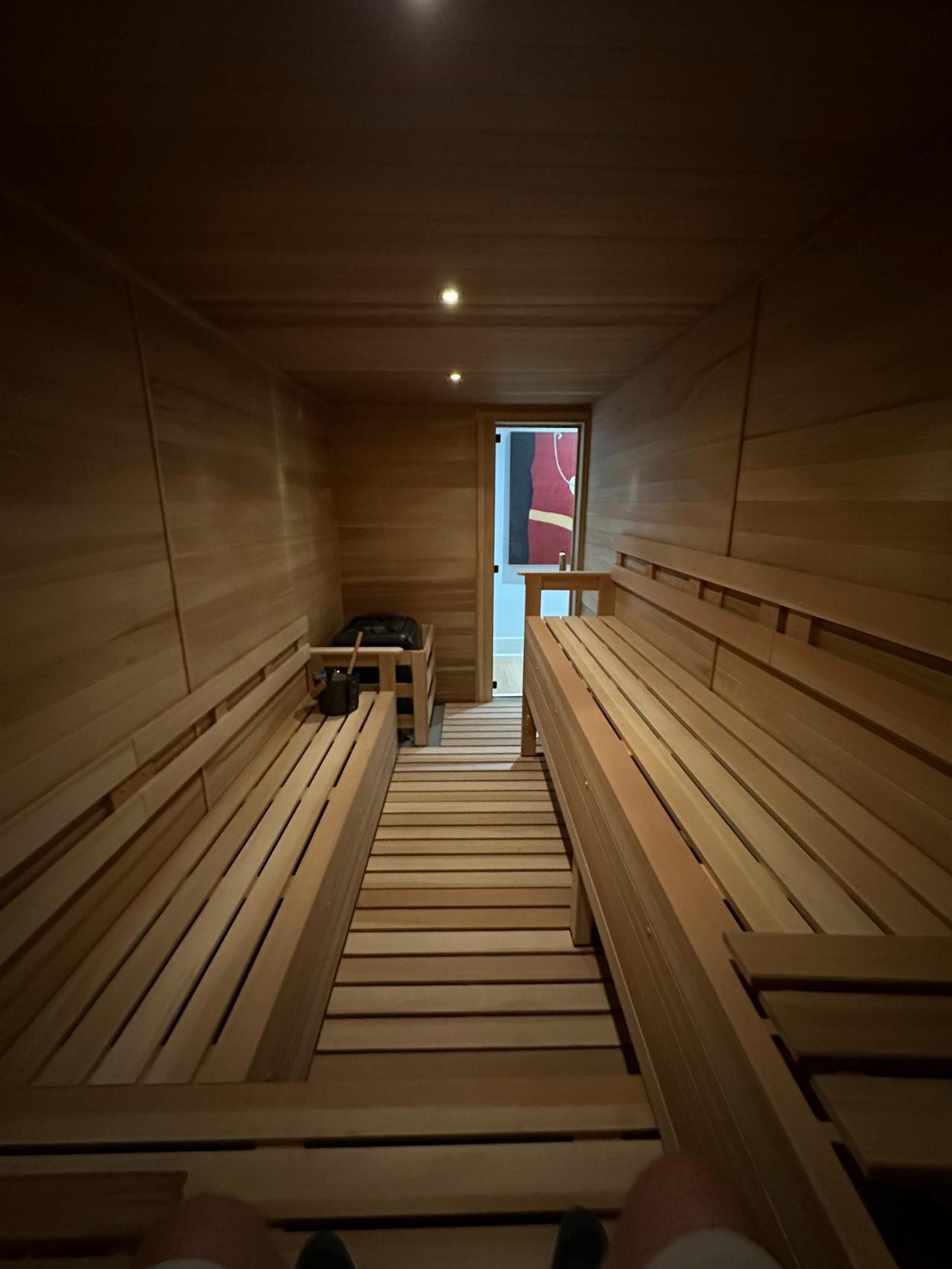 Warm cedar galley sauna with facing benches